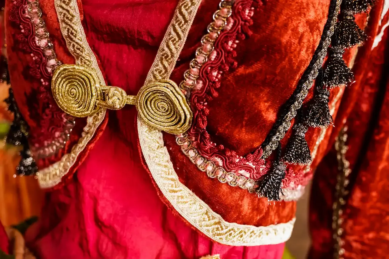 Ornate red garmet with gold embellishments
